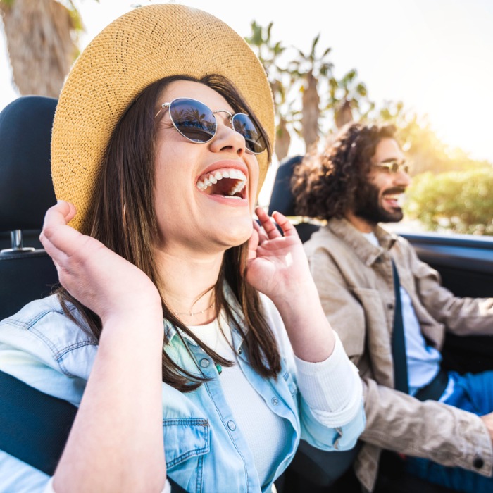 Couple enjoying convertible car ride